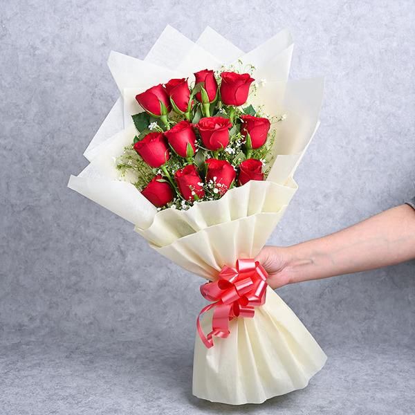 12 red rose flower bouquet with white paper paking premium quality