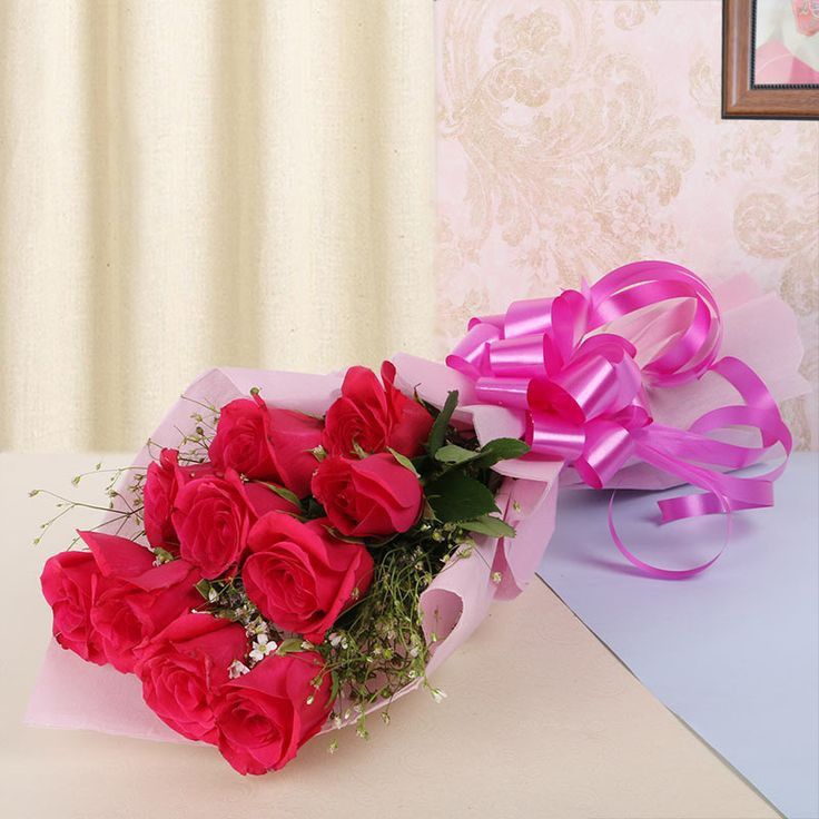 10 red rose with pink paper paking